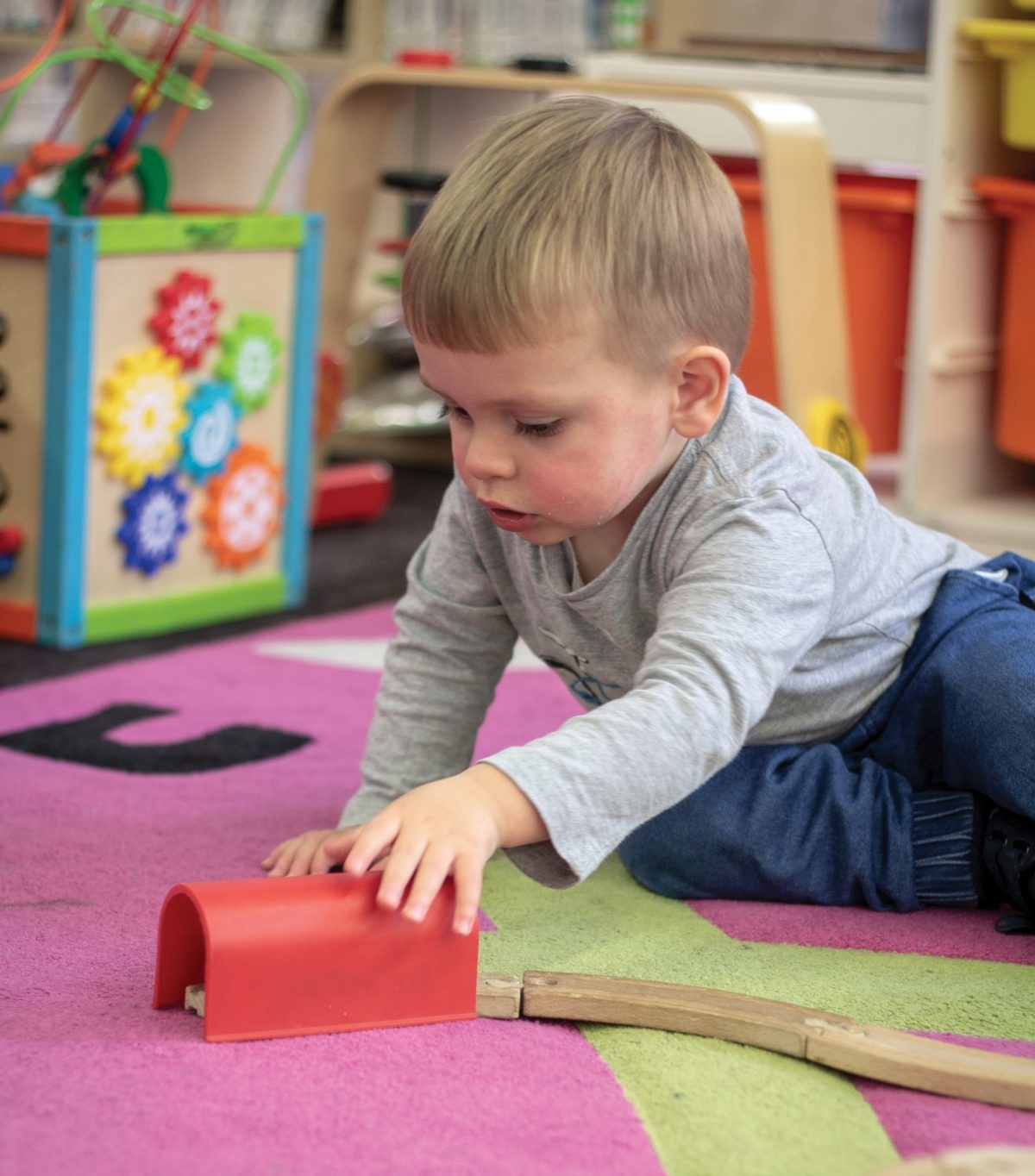 Jack loves playing with the train set at Noarlunga Library
