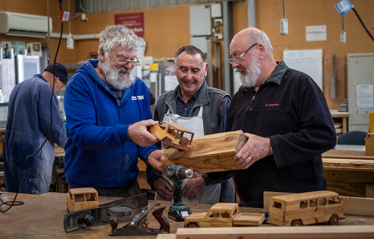 Community shed participants Jeff Wrigley, Charlie Burbidge and Allan Fettke making toys in the community shed