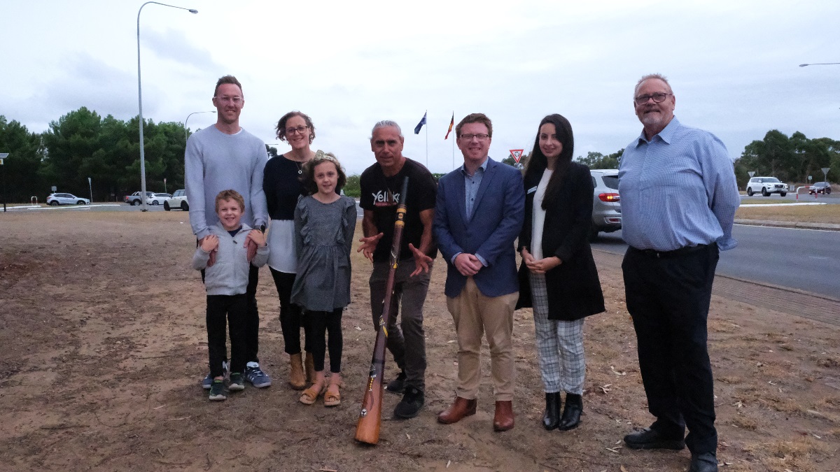Summer and her family, Karl Telfer and elected members in front of the Flagstaff Hill roundabout.