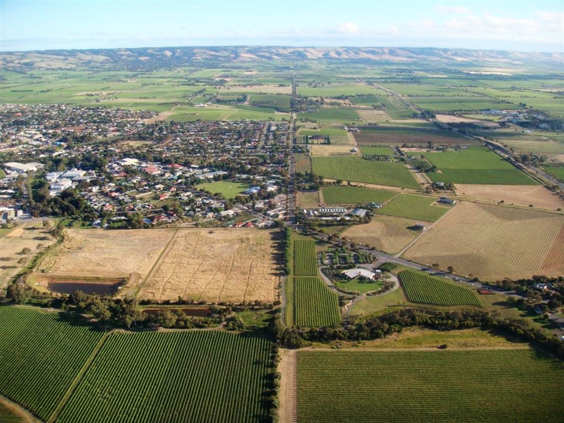 An aerial view of the township, roads and vineyards of McLaren Vale.