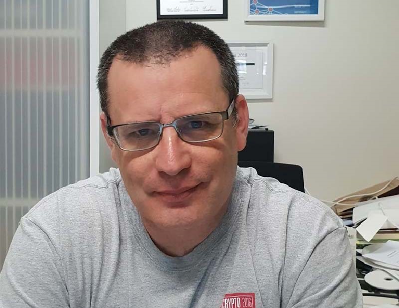 A smiling portrait of Associate Professor Yuval Yarom.