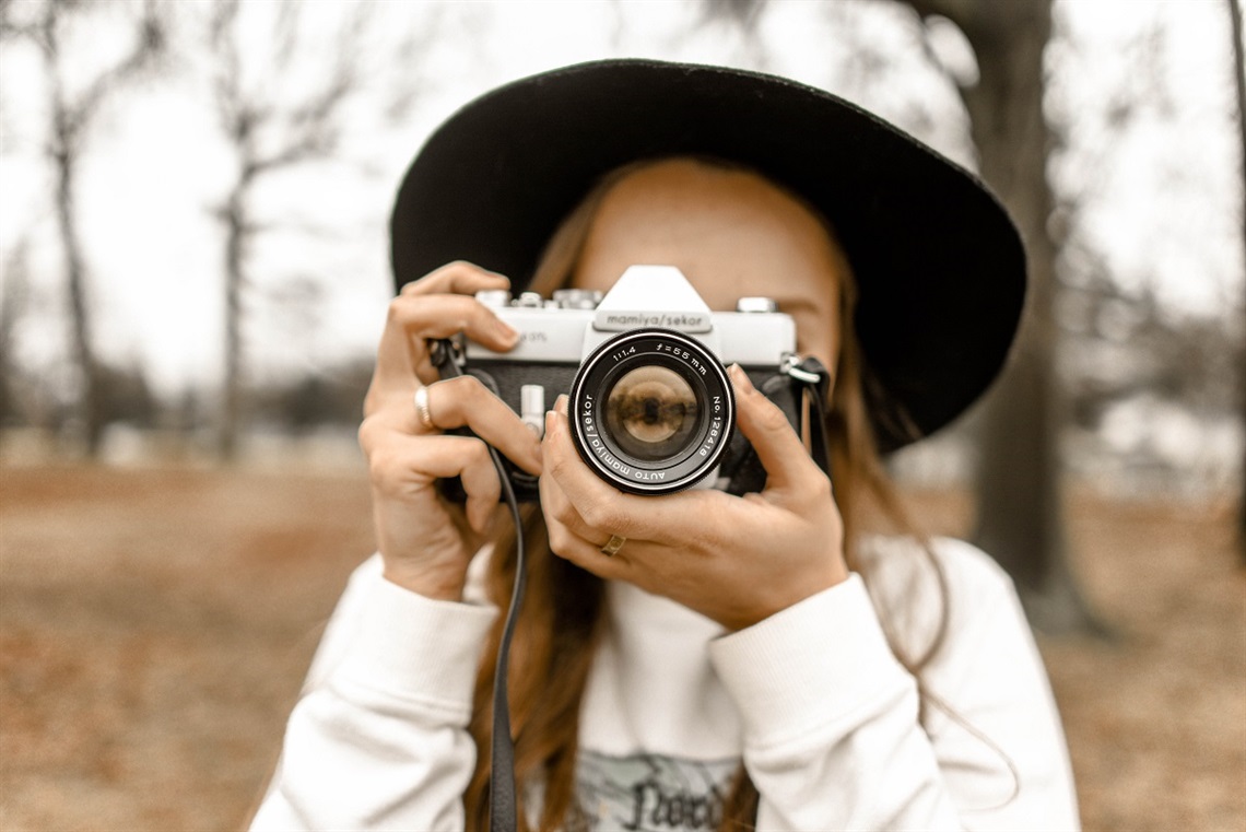 Young woman taking a photo