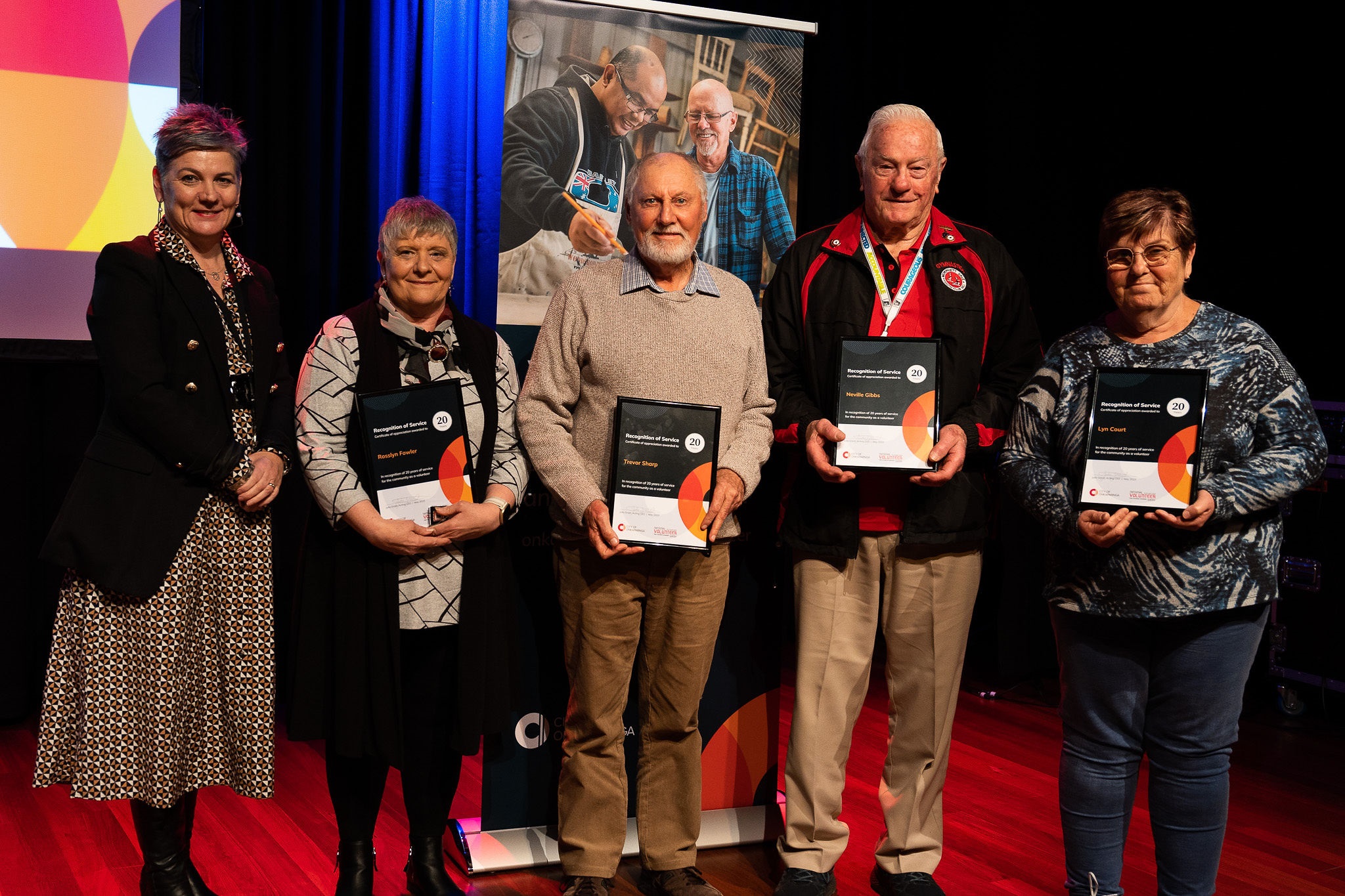 2 Left to right Acting CEO Julia Grant and Rosslyn Fowler Trevor Sharp Neville Gibbs Lyn Court receiving 20 year Recognition of Service Certificate.jpg