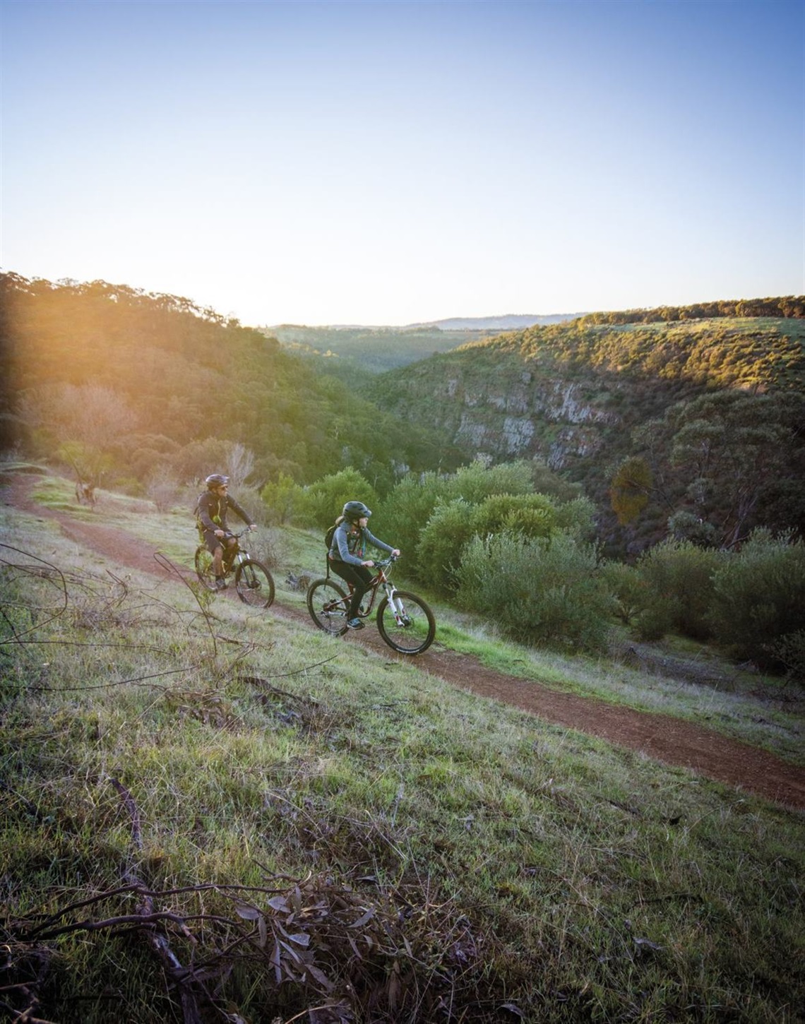 Heath Riggs and daughter, Ella, cycle the Punchbowl trail