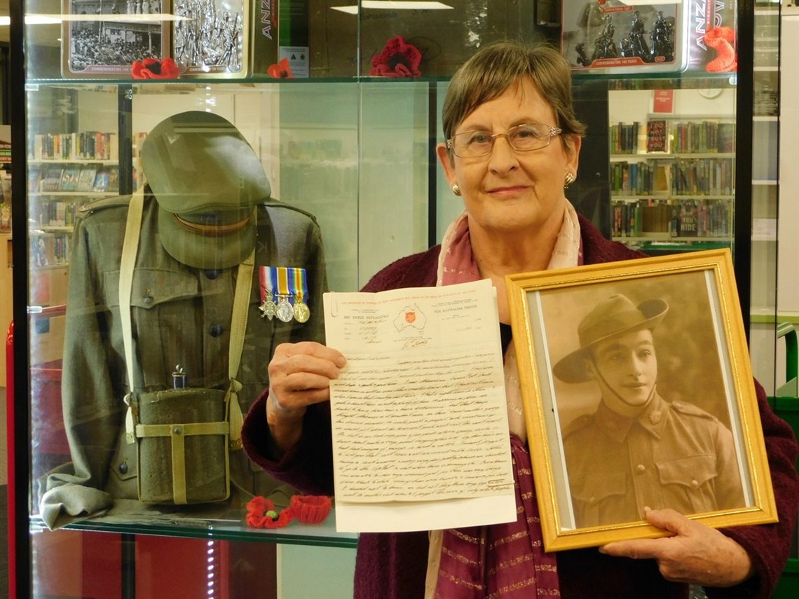 Sandra Bailey with a photo of Harold Rice.