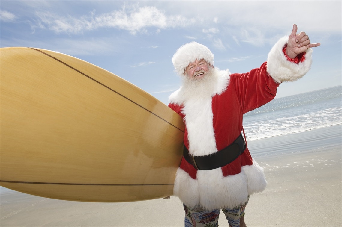Santa with a surfboard