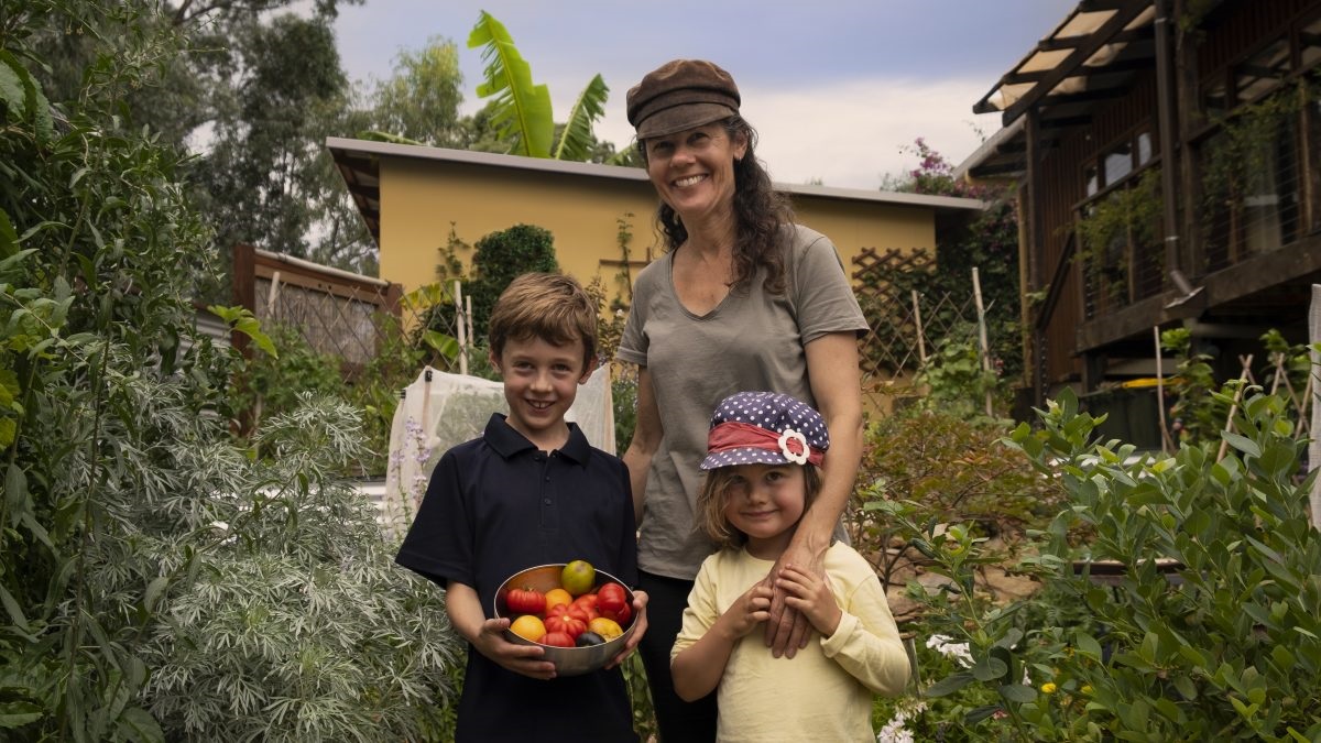 Elliot, Macey and Amanda with their freshly picked tomatoes