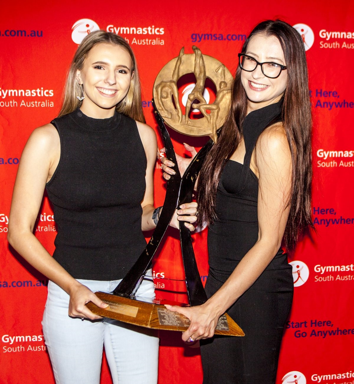 Cassie Netz and Emma Murray accept the Best Club Overall award.