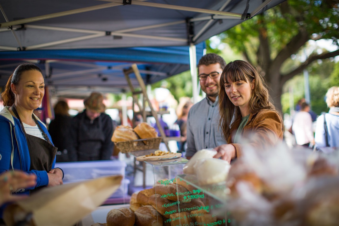 Shoppers at the Willunga Farmers Market, where locals sell Willunga produce and products, including honey, vegetables, juices and olives