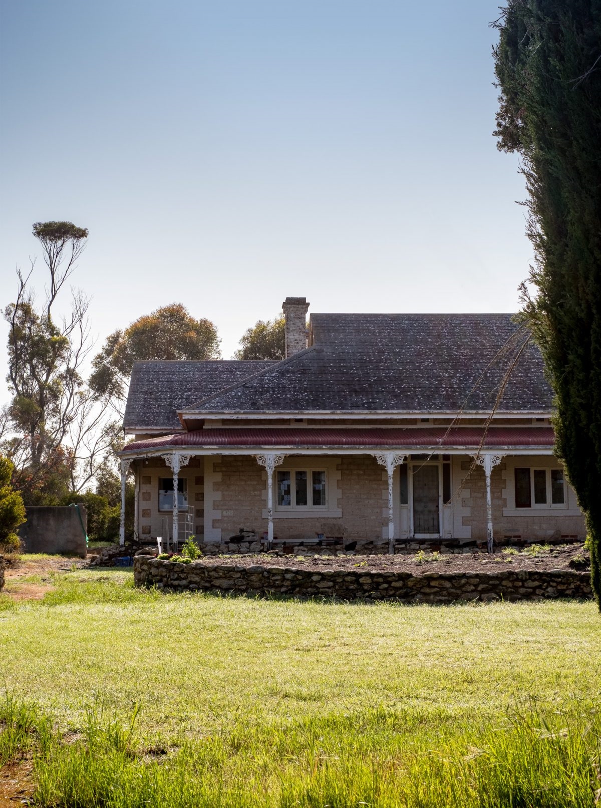 the house constructed from stone salvaged from the flour mill chimney