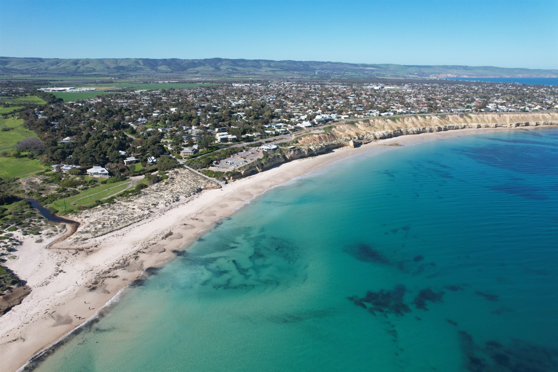 An aerial view of the coastline and suburb of Aldinga.