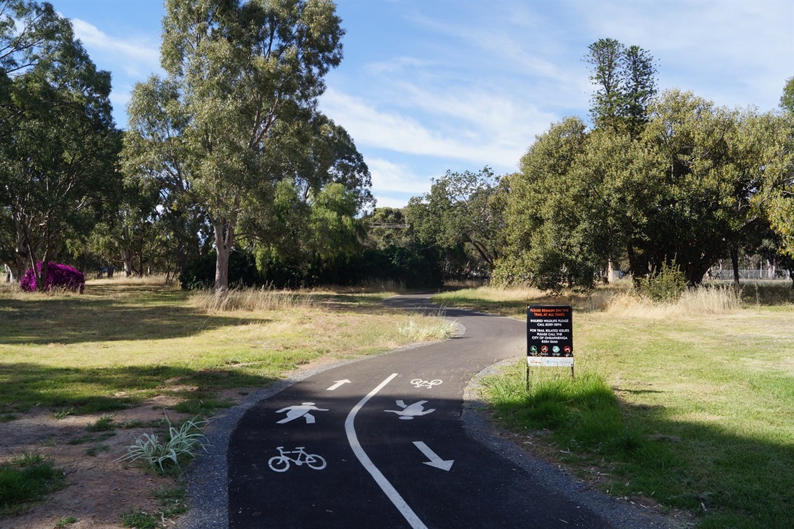 A view of the tree-lined shared-use path along Happy Valley Drive.