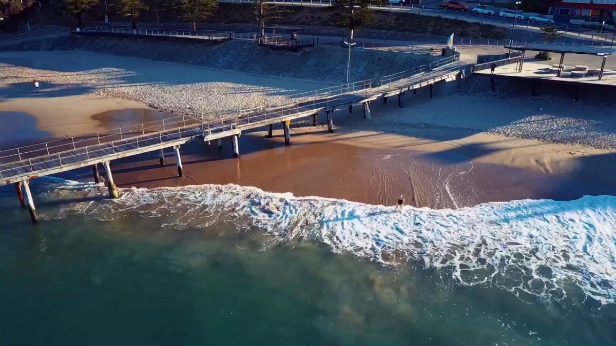 An aerial view of the Port Noarlunga jetty and coastline.