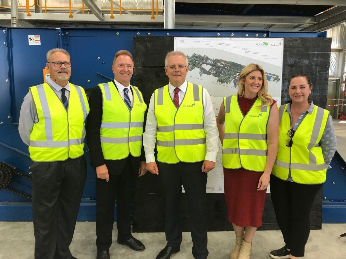 Councillor Richard Peat standing alongside council CEO Scott Ashby, Prime Minister Scott Morrison, Mayor Erin Thompson and Councillor Heidi Greaves during a funding announcement at the Southern Materials Recovery Facility.