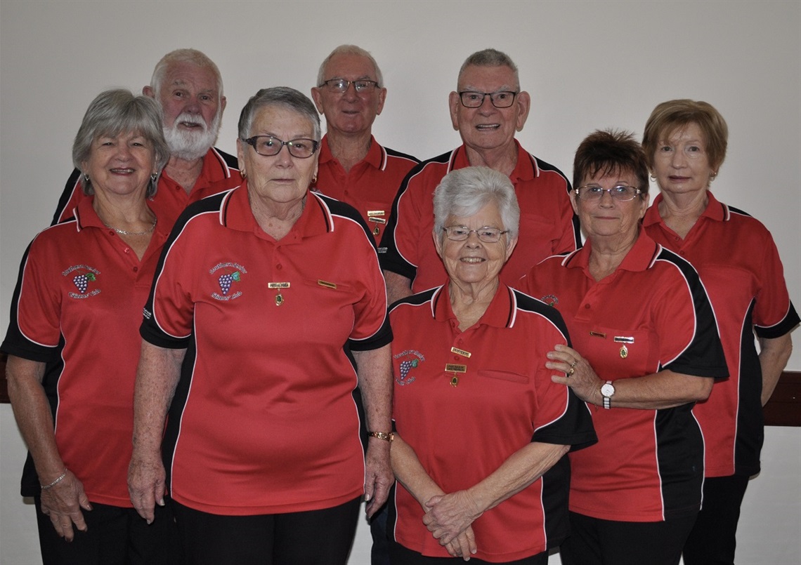 A photo of the smiling Southern Senior Citizens Club committee for 2022, wearing their red polo shirts.