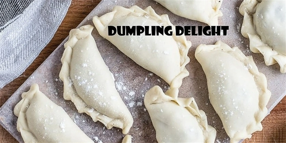 A tray of dumplings ready to be cooked.