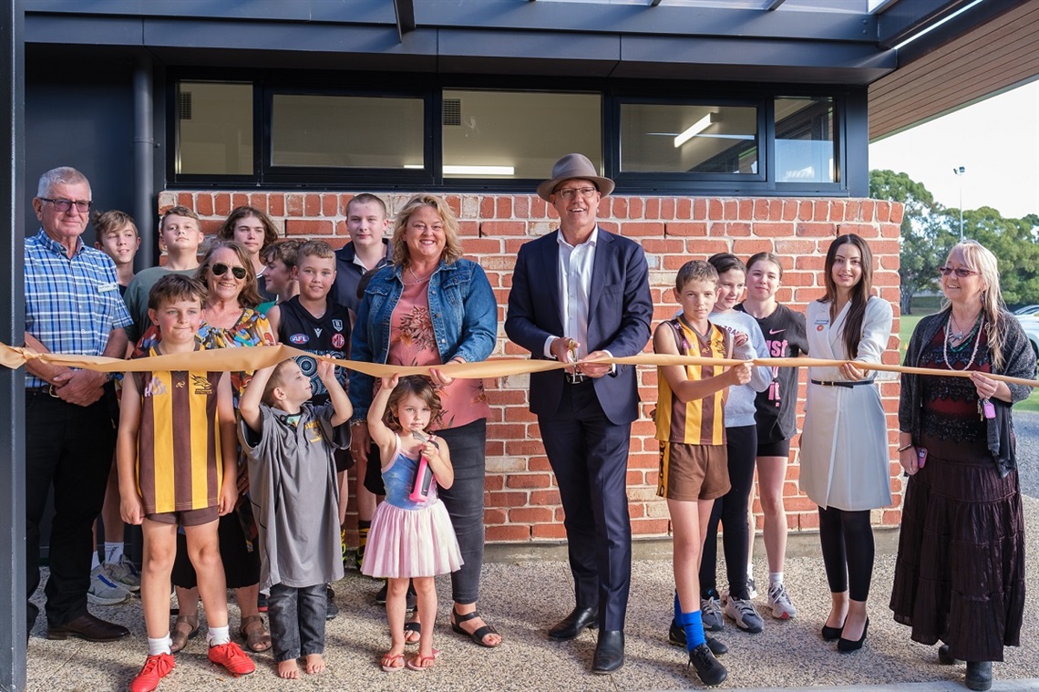 Players, council members and Minister Corey Wingard cut the ribbon at the new changerooms.