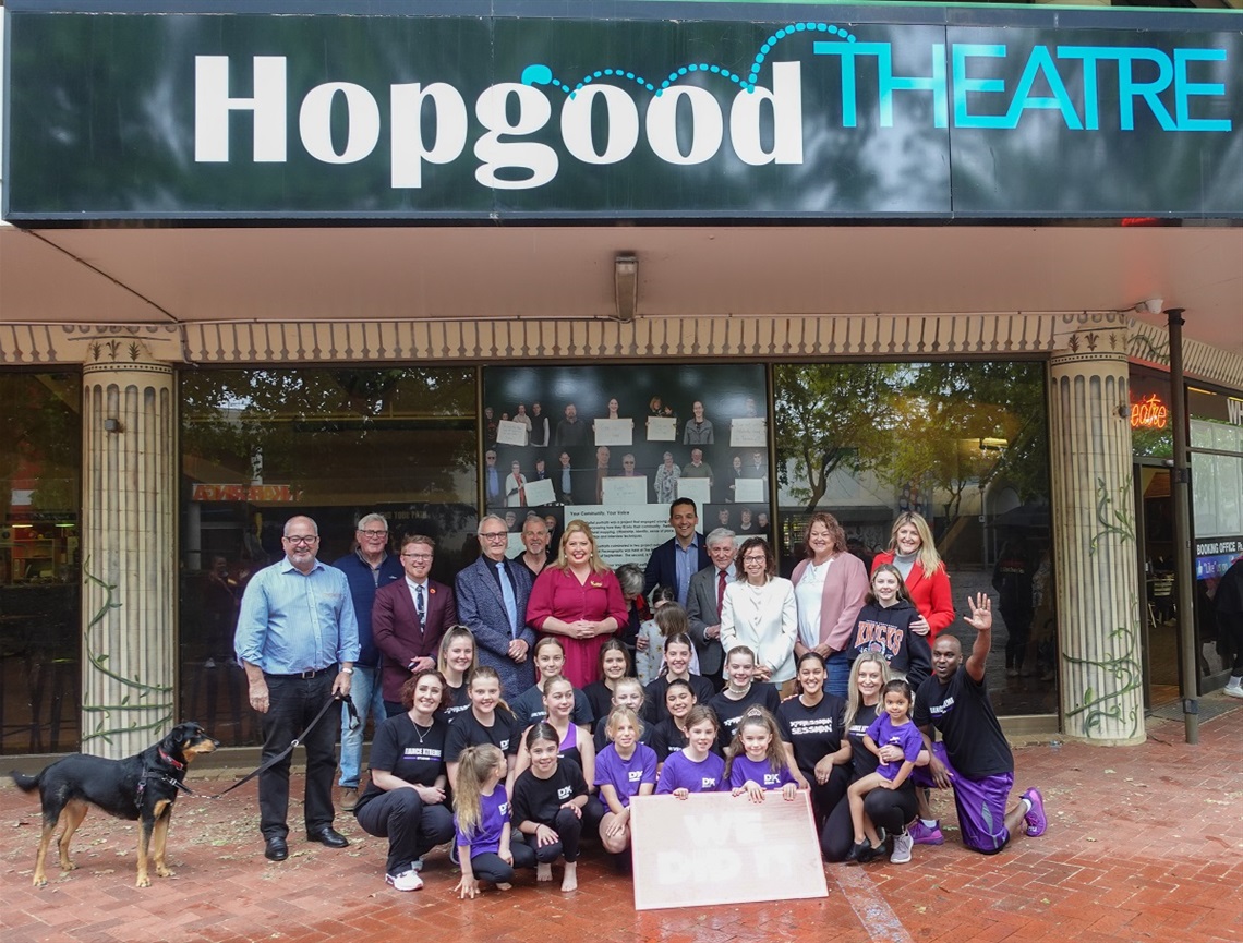 People celebrating the Hopgood Theatre announcement out the front of the theatre.
