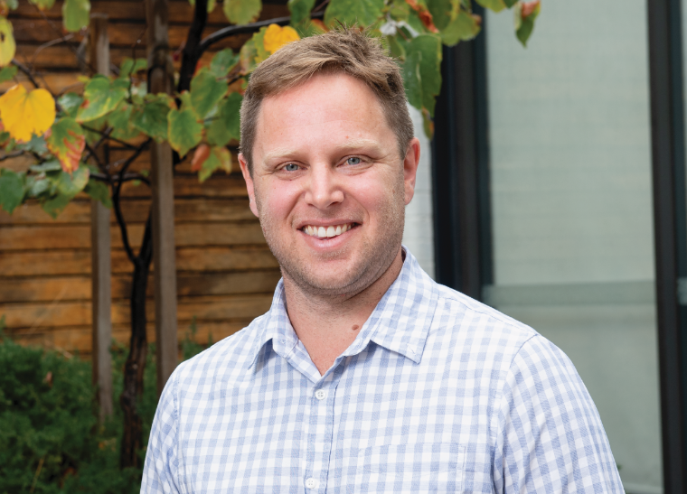 A smiling portrait of Dr Brenton Hordacre.