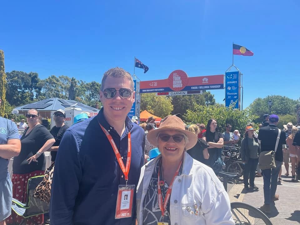 South Australia's Police, Emergency Services and Correctional Services Minister, Joe Szakacs, smiles with Mayor Moira Were at the 2023 Santos Tour Down Under.