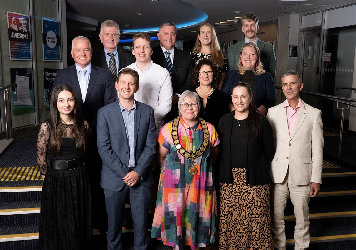 A photo of the 13 incoming elected members standing alongside each other and smiling outside the Noarlunga Council chamber following their swearing in ceremony.