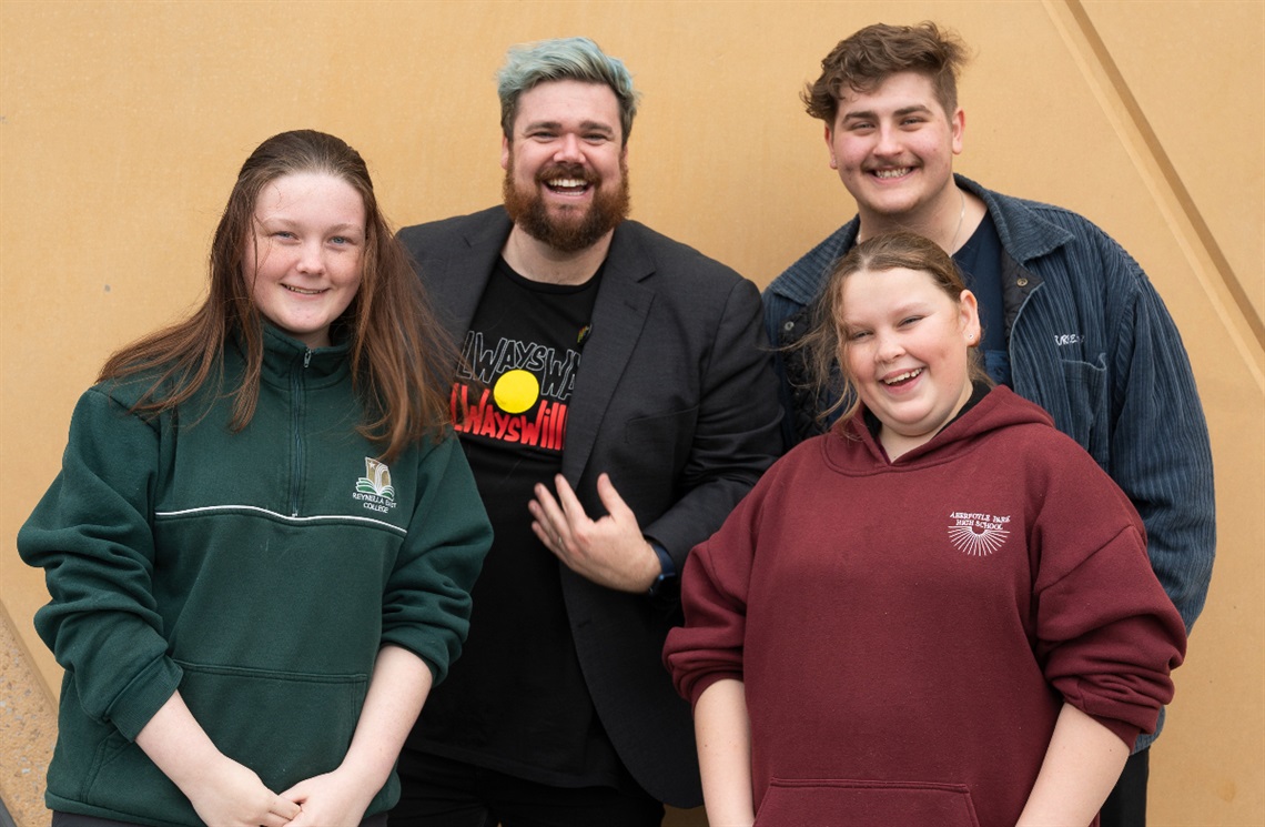 City of Onkaparinga's Community Development Youth Coordinator Joshua Stokes smiles with three Onkaparinga Youth Committee members, Lani, Lucy and Darcy.