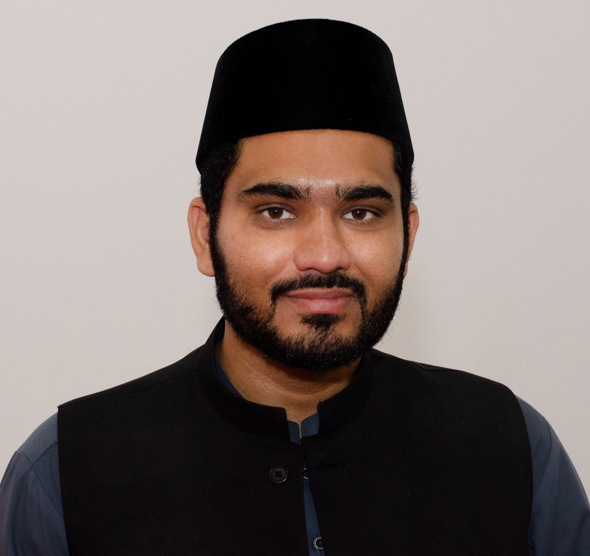 A portrait of Regional Imam Atif Ahmed Zahid.