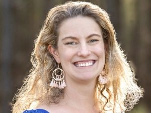 A smiling portrait of Associate Professor Sarah Cohen-Woods.