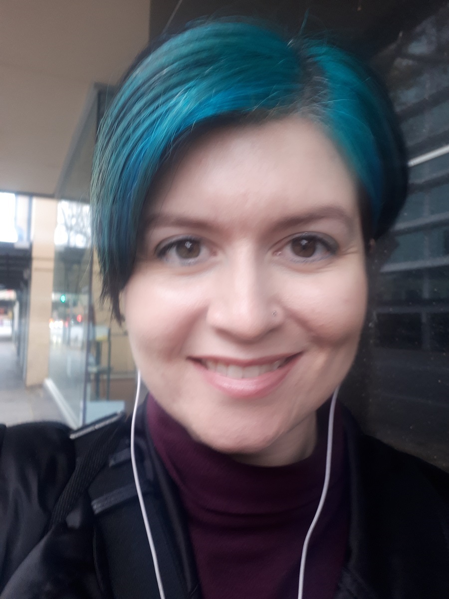 Season takes a selfie with blue dyed hair.