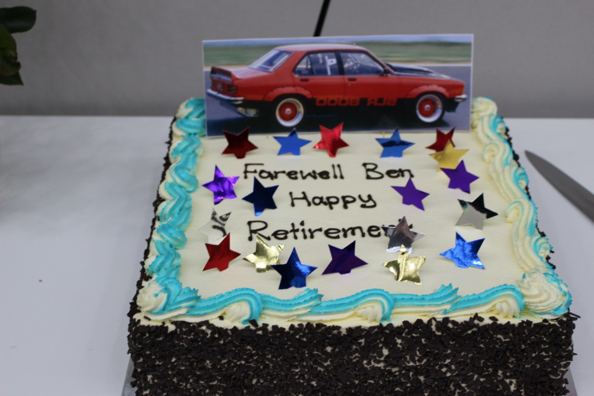 A photograph of Ben's farewell cake with the words 