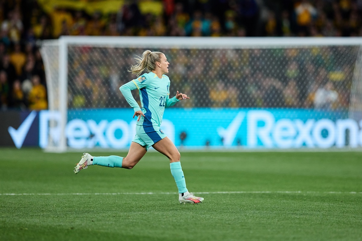 Matildas player Charli Grant strides across the pitch during a FIFA Women's World Cup game.