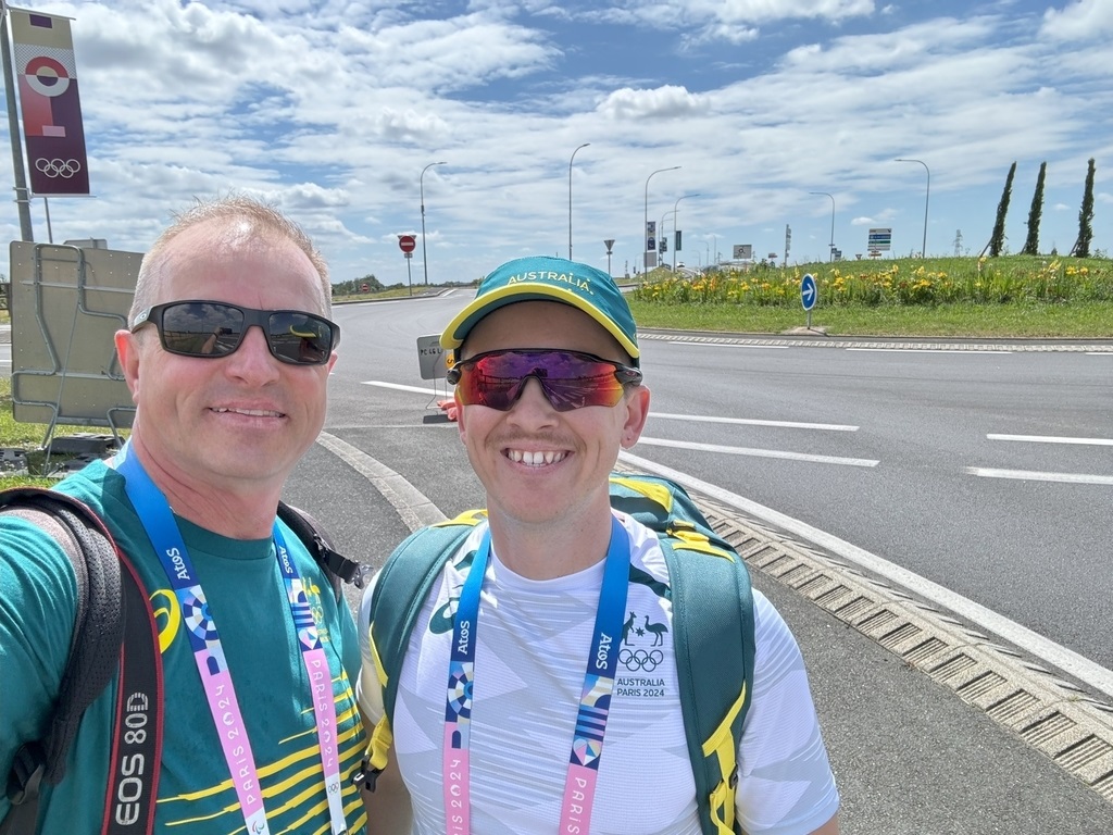 Olympic rifle shooter Jack Rossiter and coach Petr Kurka smile in France.