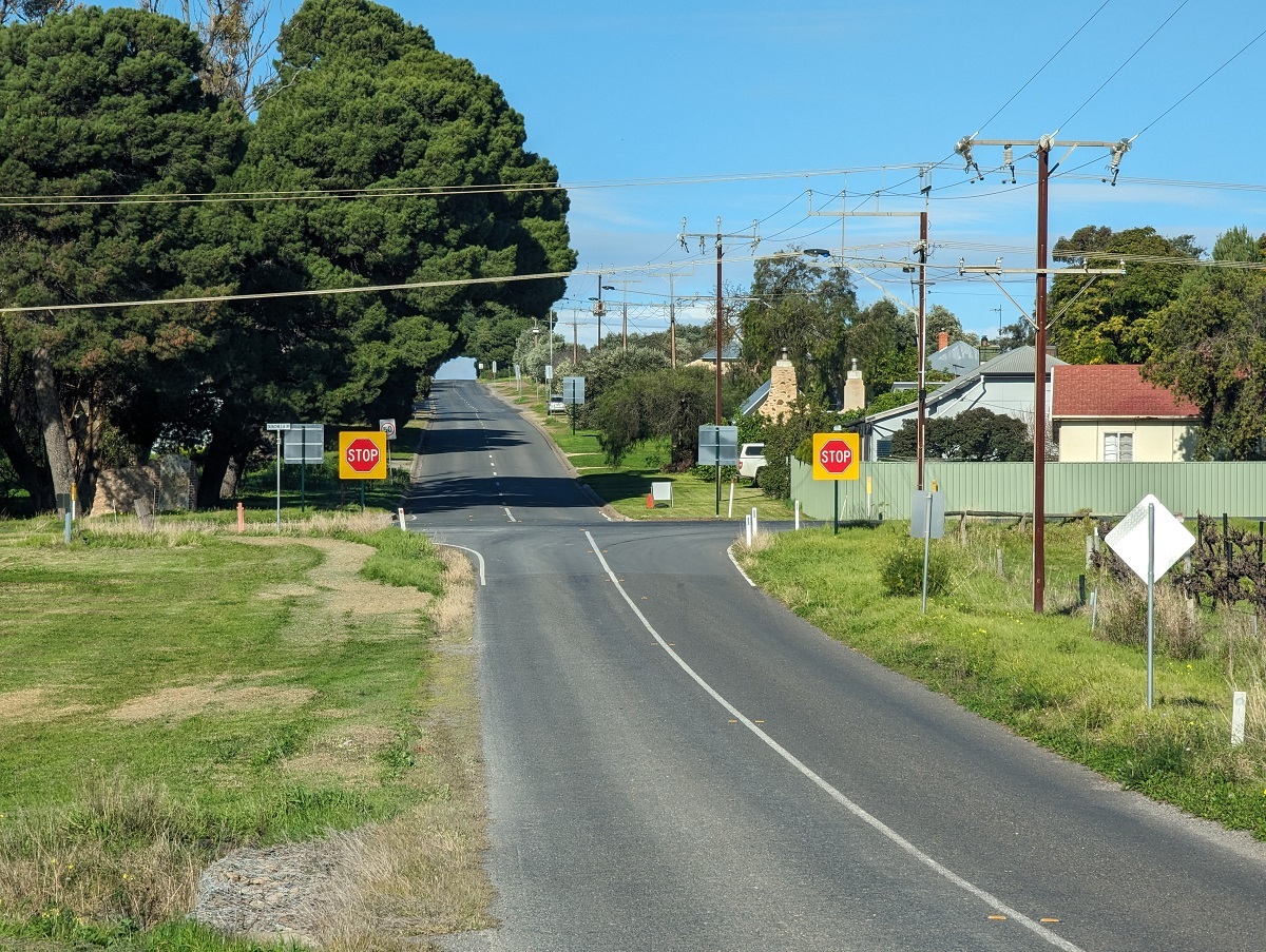Two bright new stop signs alongside a McLaren Vale intersection.