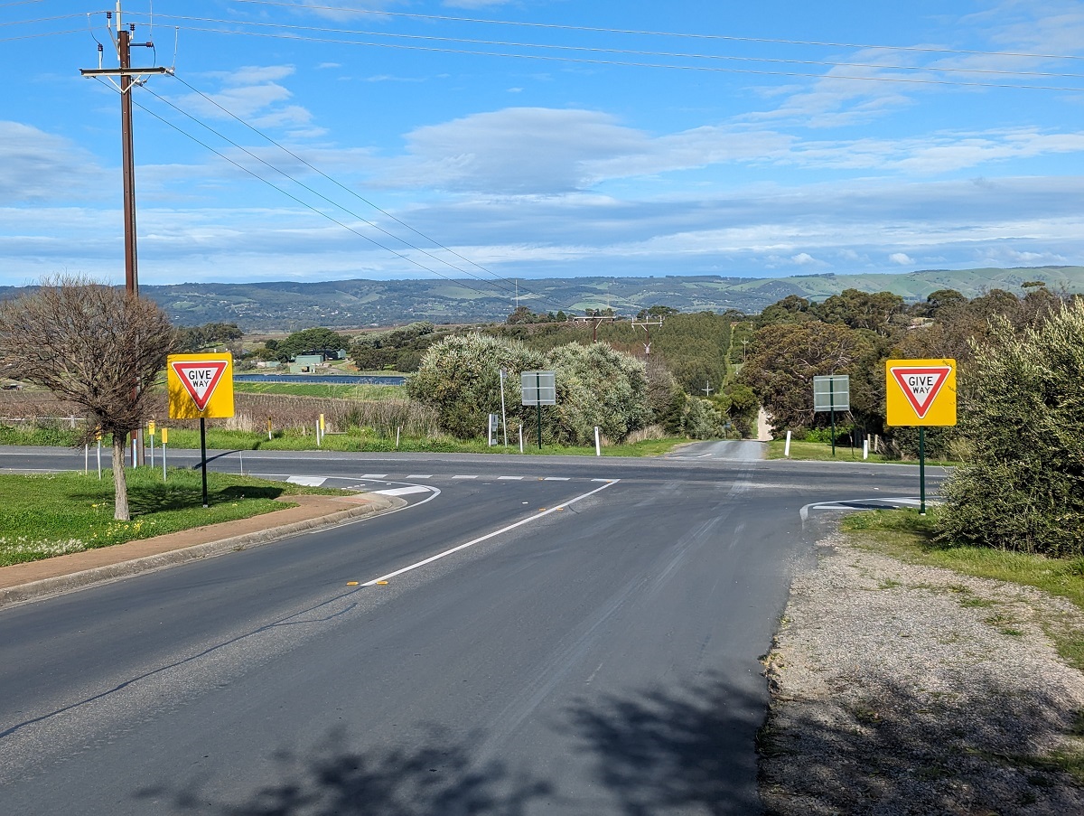 Two bright new give way signs at a McLaren Vale intersection.