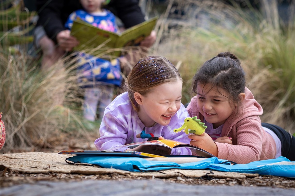Photo of Laticia and Charlotte meeting their finger puppets
