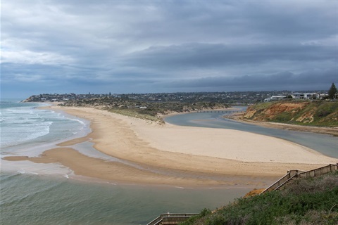 A photograph of the Onkaparinga River mouth and South Port beach from the clifftop.