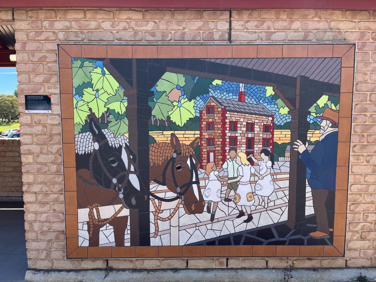 A photo of a mosaic artwork on the amenities building at the Old Reynella Horse Changing Station.