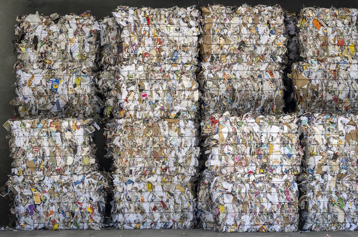Cubed stacks of processed paper and cardboard sit in neat piles in a storage shed at the Southern Materials Recovery Faciliity.