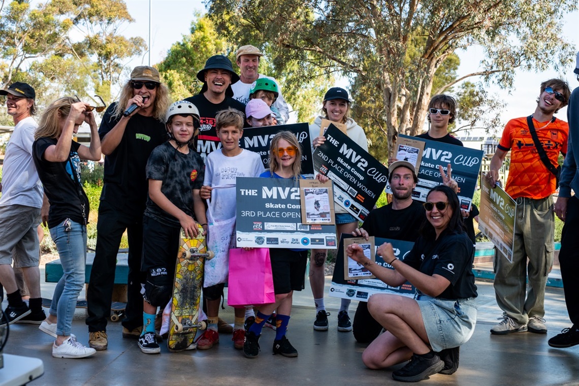 A group of skateboarders smile with their awards at the Morton Road skate park during the Mv2 Cup.