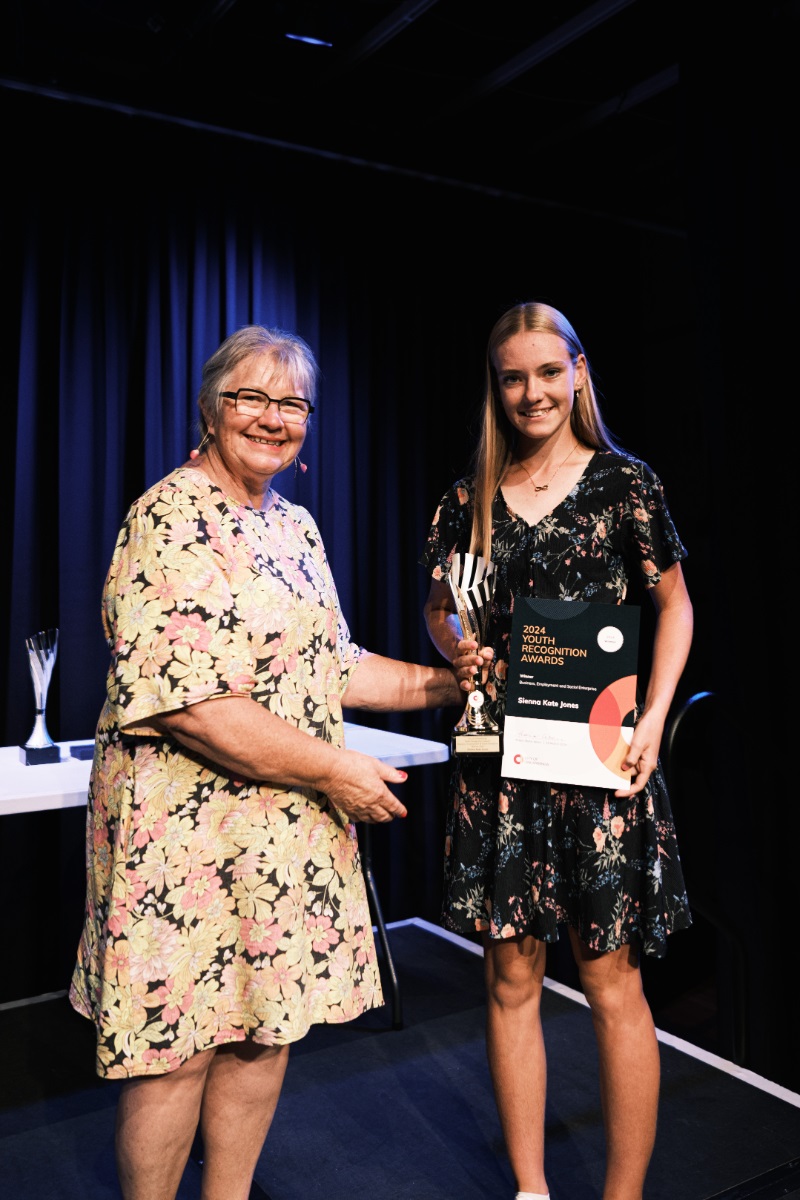 City of Onkaparinga Mayor Moira Were presents a certificate and trophy to Sienna Kate Jones during the 2024 City of Onkaparinga Youth Recognition Awards ceremony.