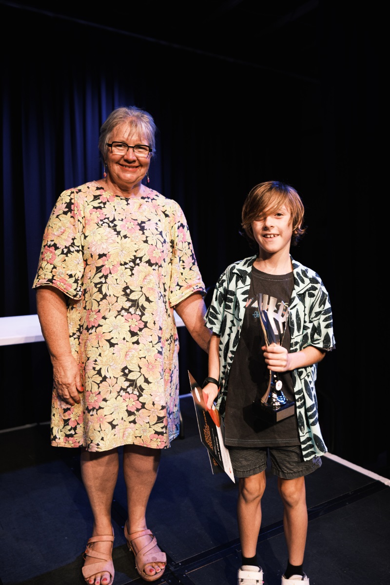 City of Onkaparinga Mayor Moira Were presents a certificate and trophy to Jack Dobson during the 2024 City of Onkaparinga Youth Recognition Awards ceremony.