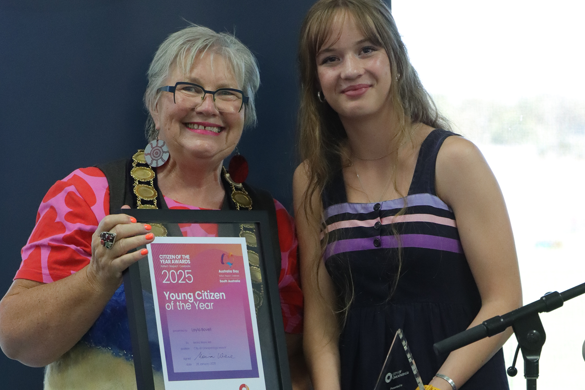 A photo of City of Onkaparinga Young Citizen of the Year Layla Bovell holding her framed award alongside Mayor Moira Were.