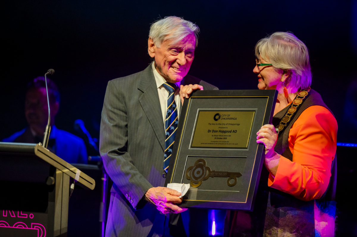 Don Hopgood AO smiles at Mayor Moira Were as she presents him with the Key to the City.