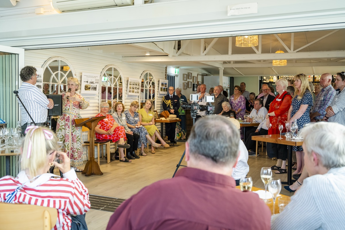 A crowd of people watches the speeches at the Port Willunga 175th annivesary celebration event.