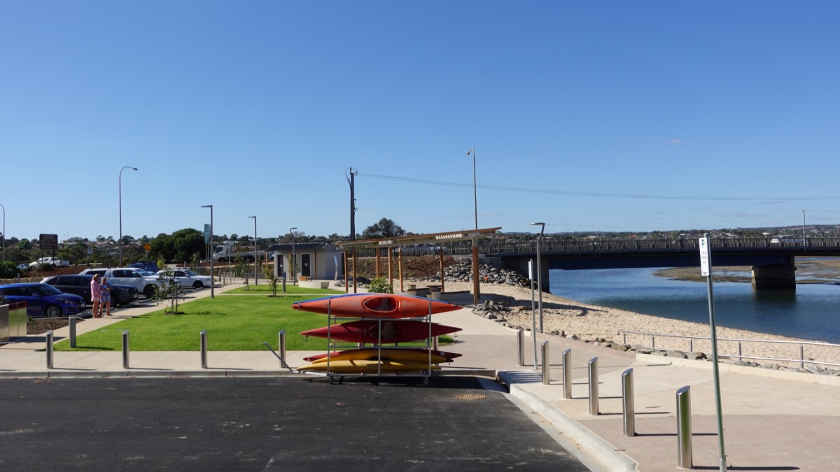 A rack of red kayaks sits in the carpark alongside the newly redeveloped Wearing Street precinct.