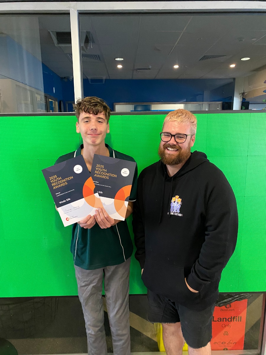 Contributions to Community Award Winner Wade Silk smiles with his certificate alongside council youth worker, Joshua Stokes.