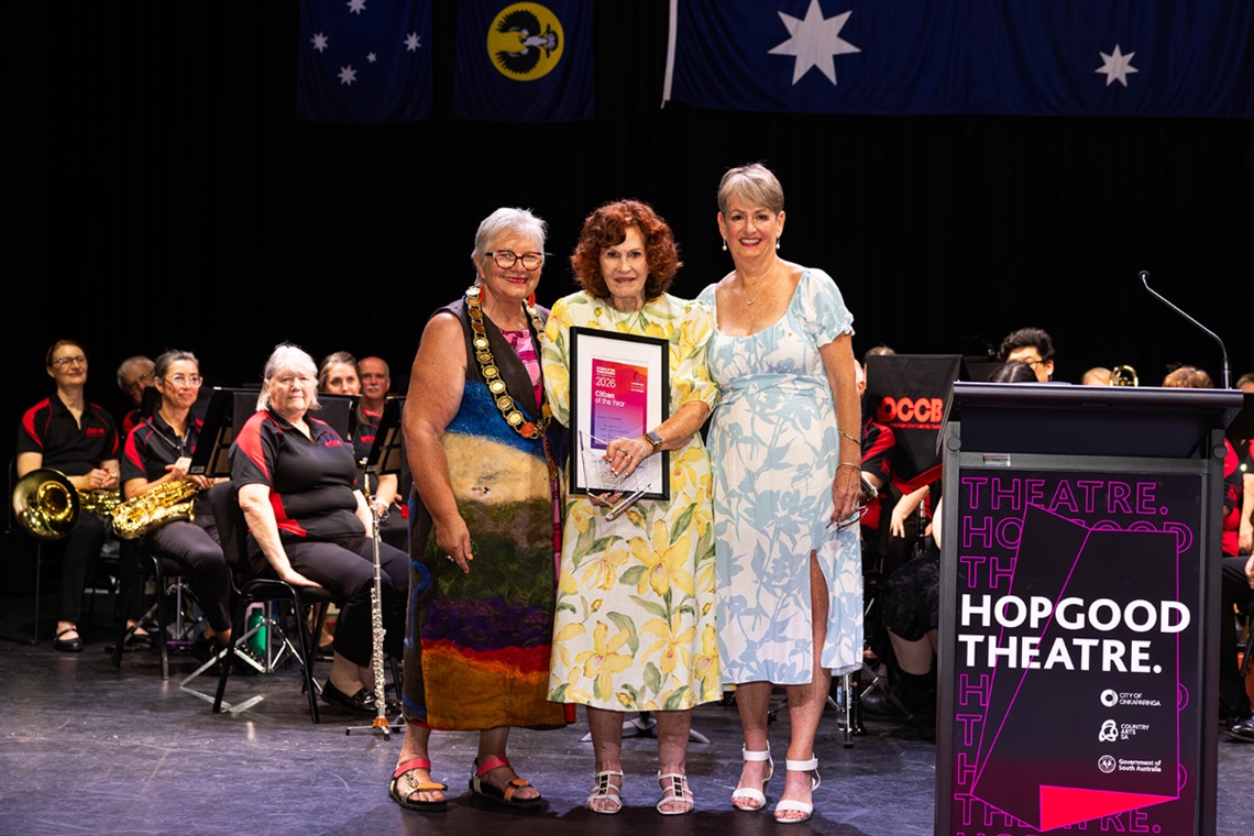 Citizen of the Year recipient Kay Wickes receiving her award on stage at the Hopgood Theatre.