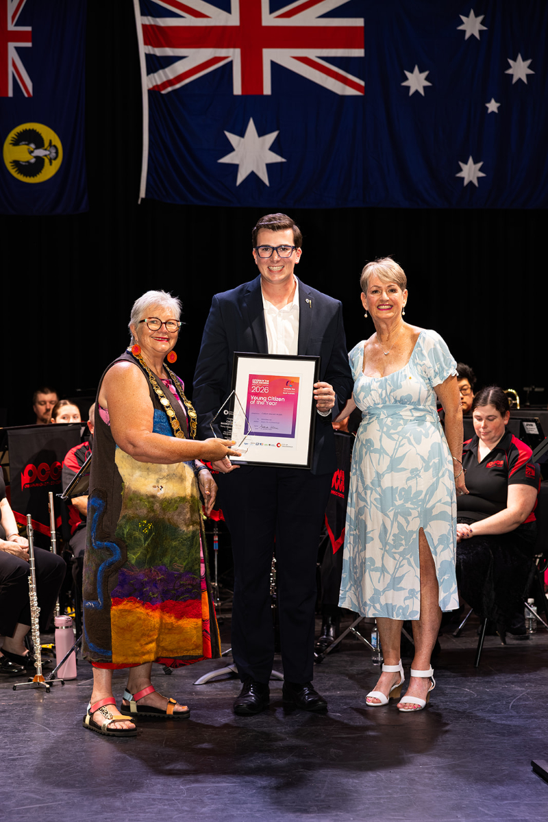 Young Citizen of the Year recipient Callum Barratt-Walsh receiving his award on stage at the Hopgood Theatre.