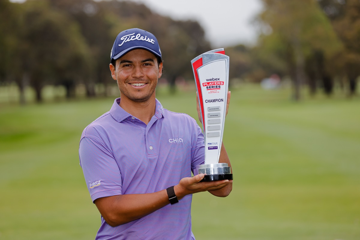2025 Players Series South Australia Winner Matias Sanchez smiles at the camera while holding his trophy.