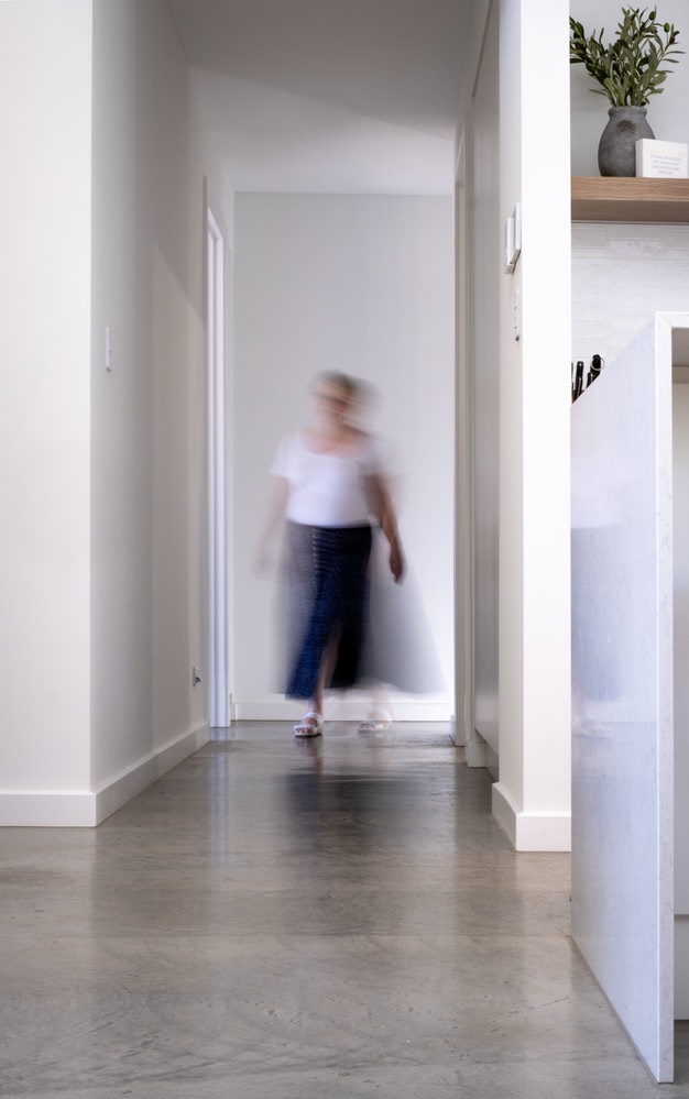 Heather walking through her home.jpg